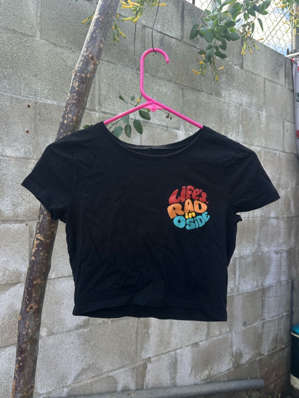 Black Crop Tee with "Life's Rad In Oside" Colorful Graphic